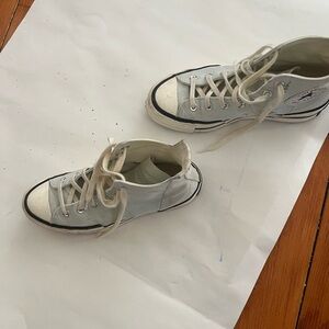 Light blue high top sneakers.